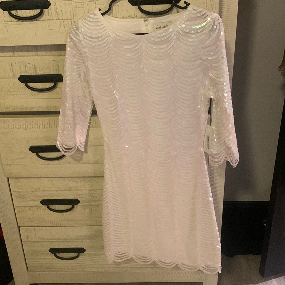 White sequin mini dress with 3/4 sleeves